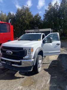 2021 F-550 VOTH DUMP BODY 4X4 REG CHAS CAB - Front Driver.JPEG